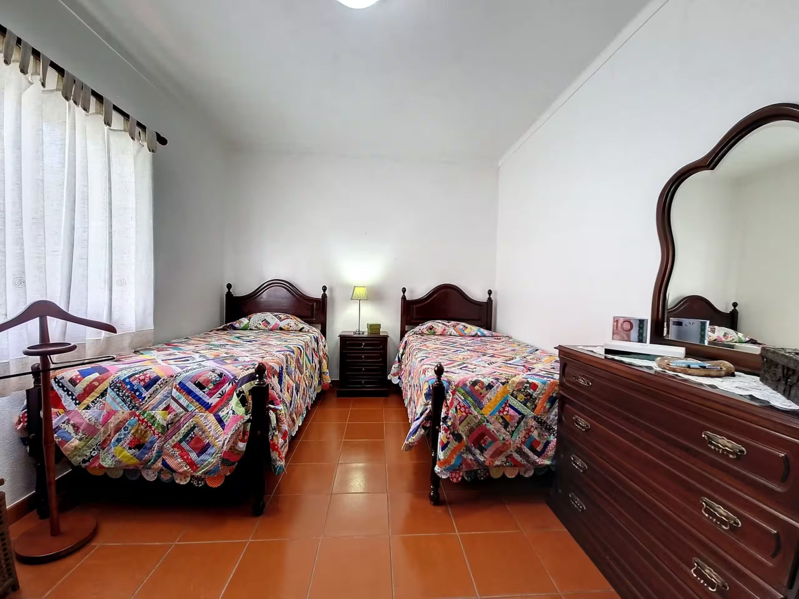 Bedroom 2 from the other side, dresser and mirror alongside the beds